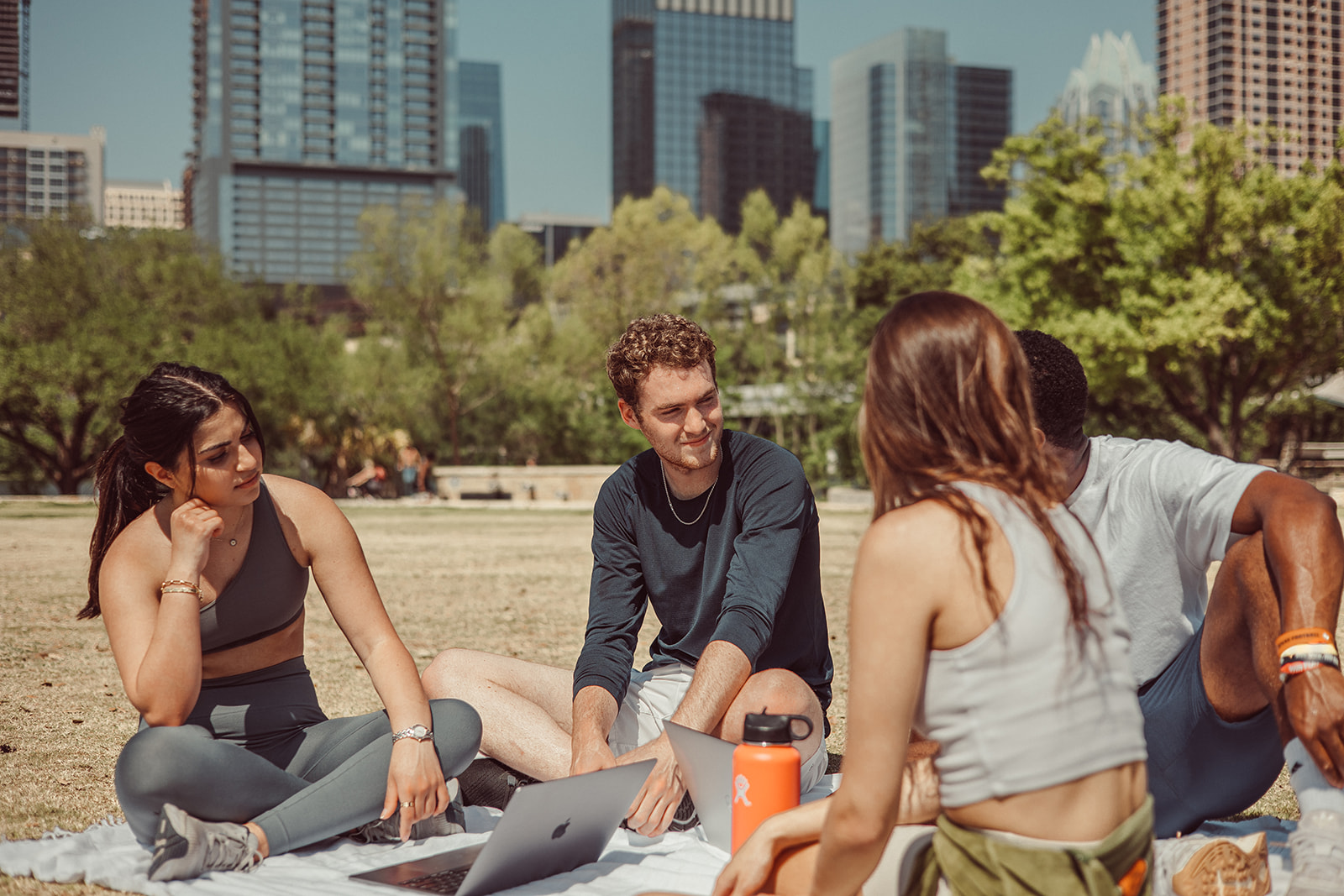 Friends studying at Zilker Park in Austin, Texas.