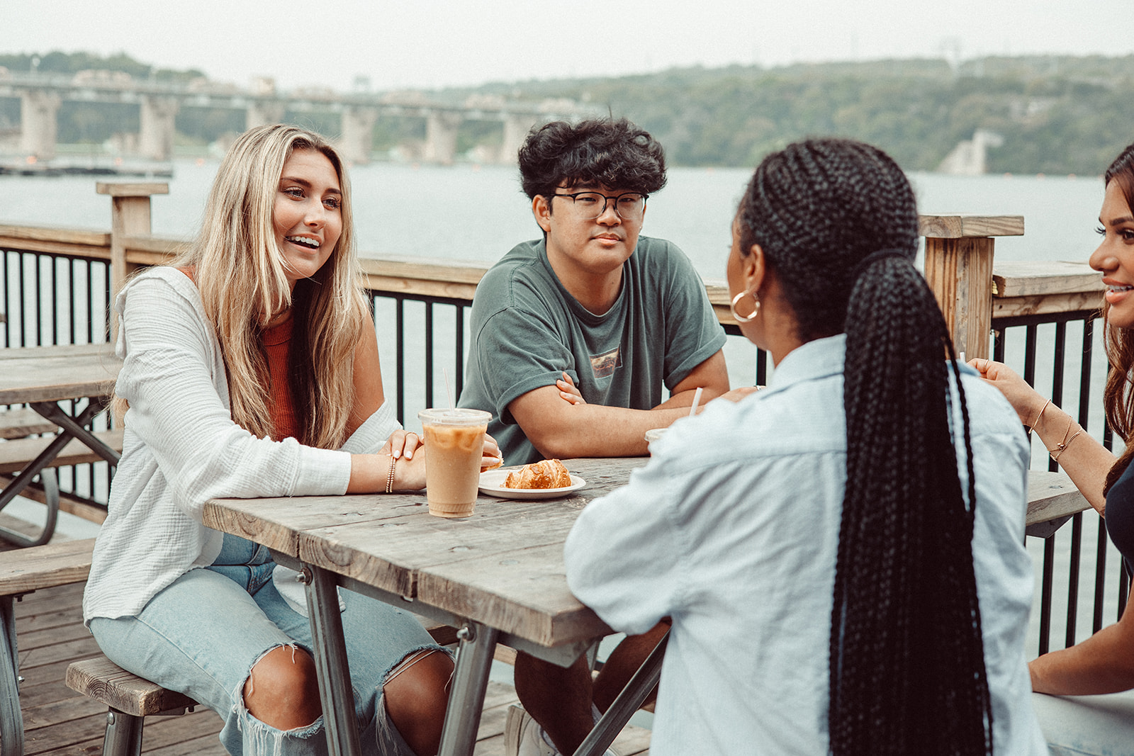 Friends talking at Mozart's Coffee Roasters in Austin.