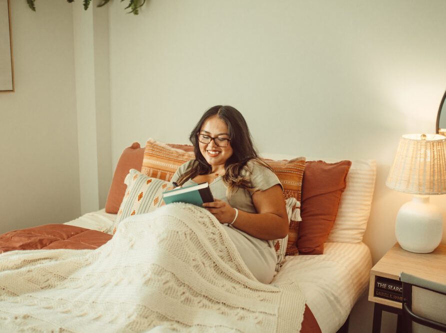 girl reading in bed at Rambler ATX