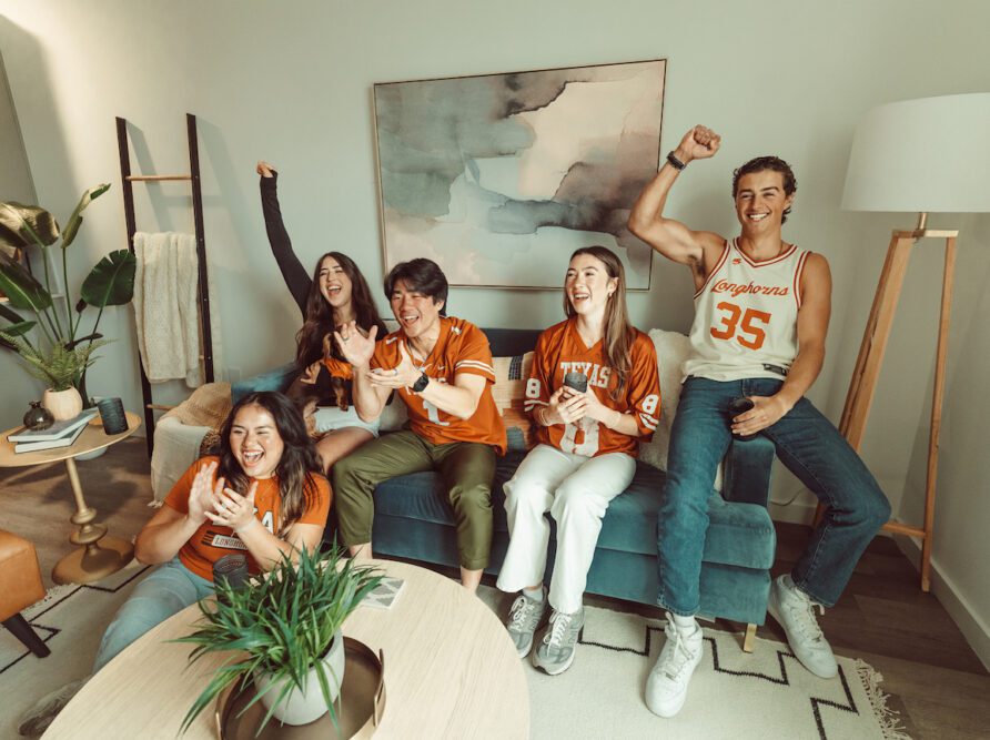 five roommates cheering on the longhorns at Rambler