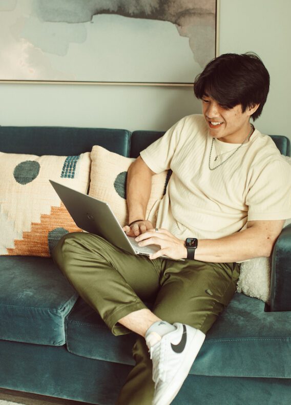 Resident in Rambler living room on computer