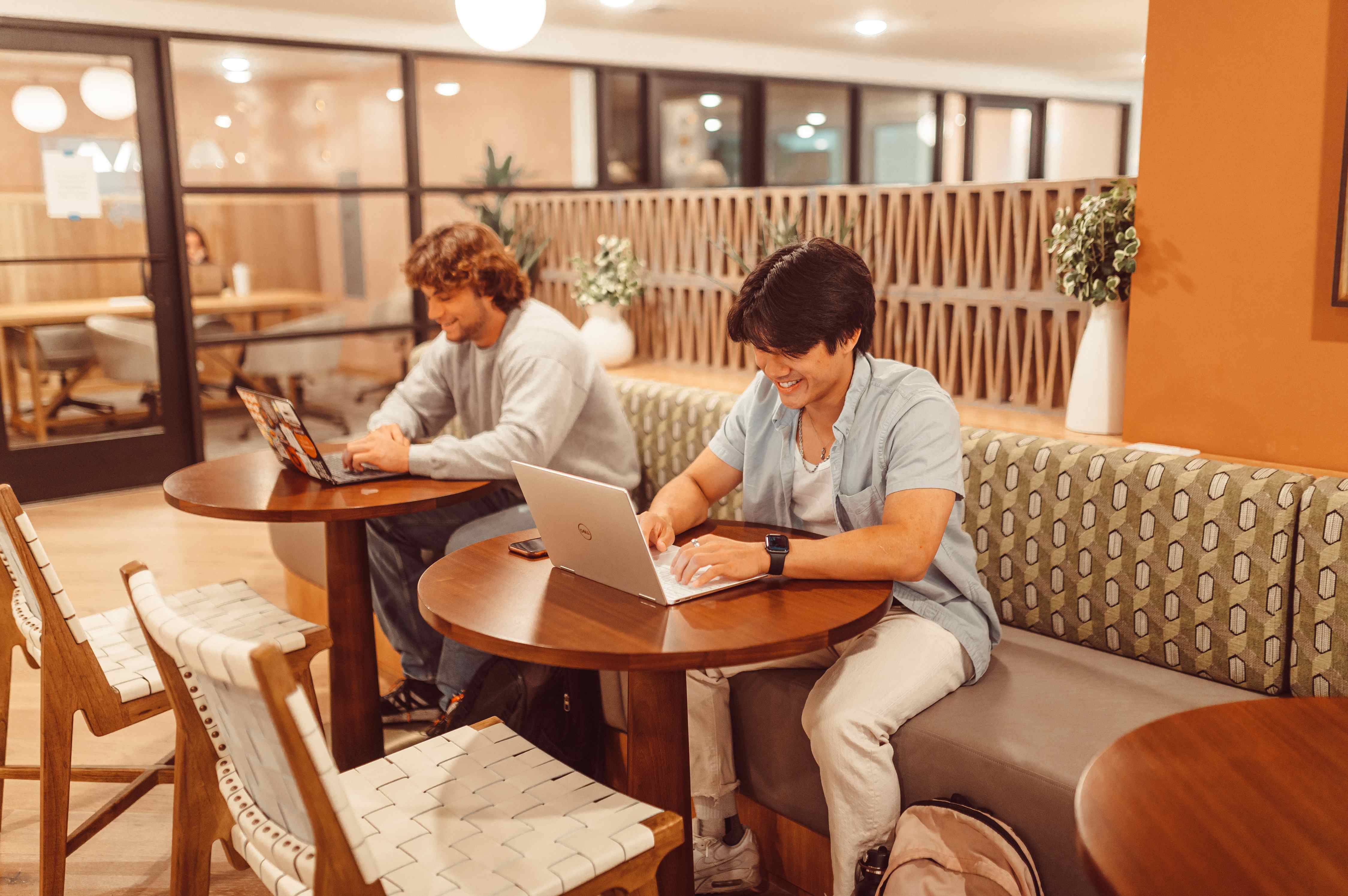 Residents on their laptop in the study space at Rambler Austin. 