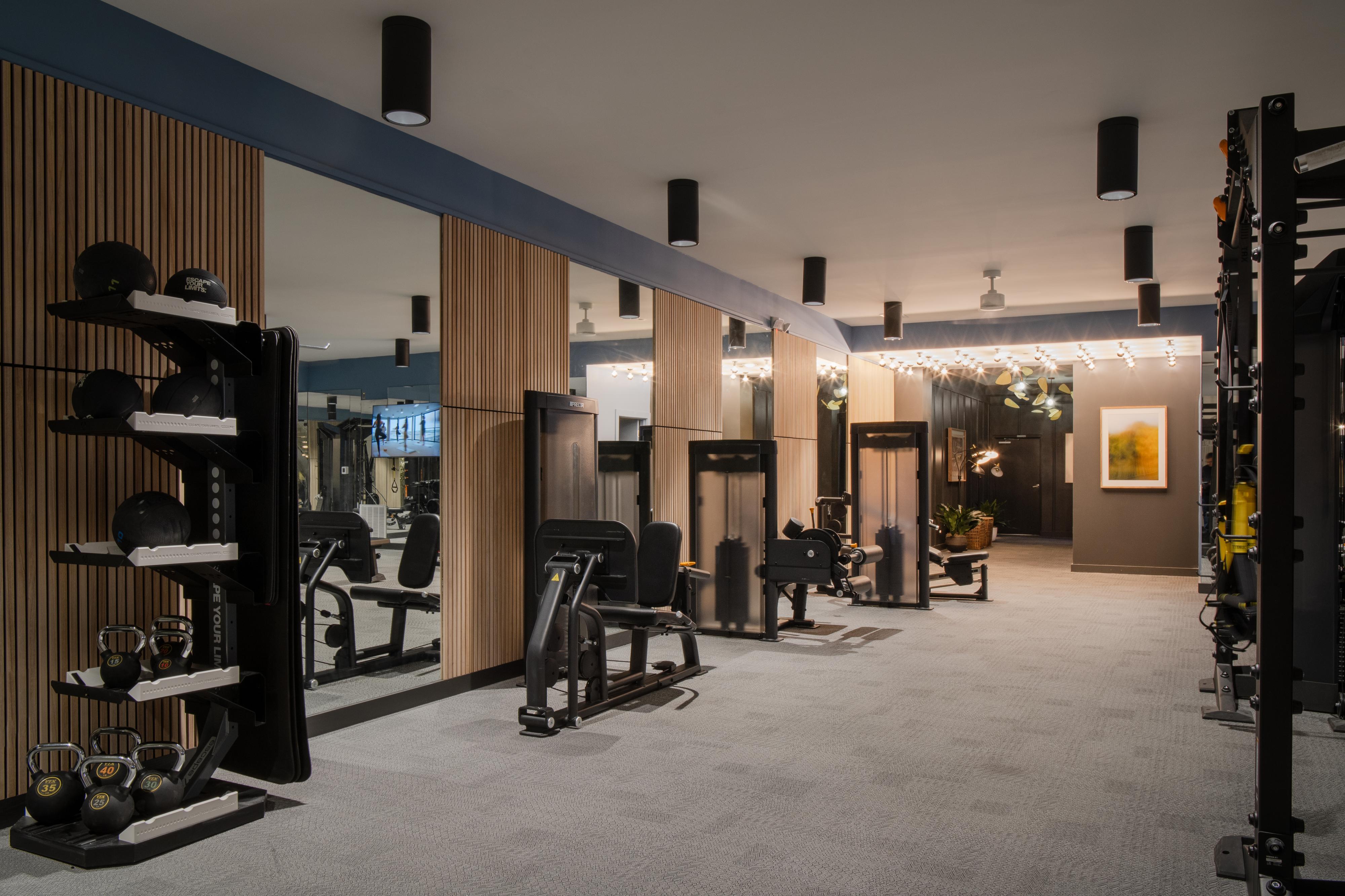 Rambler ATX gym with weights and equipment.